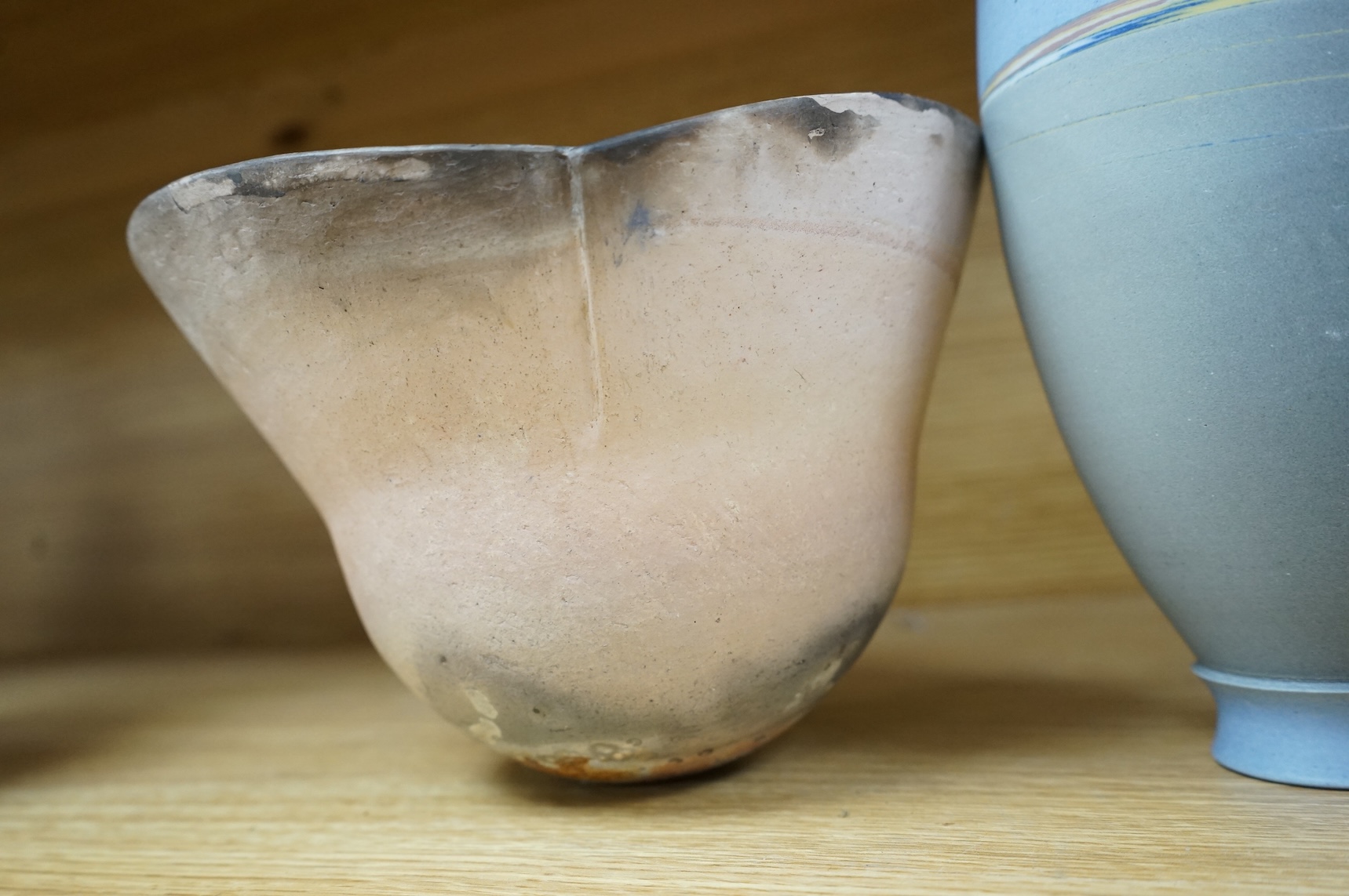 A studio pottery with incised initialled, dated ‘73 and a similar bowl, largest 21cm in diameter